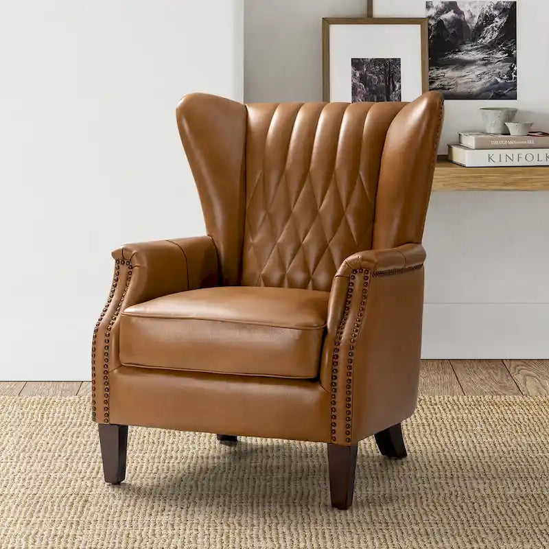 Traditionele fauteuil van echt leer met poten van massief hout