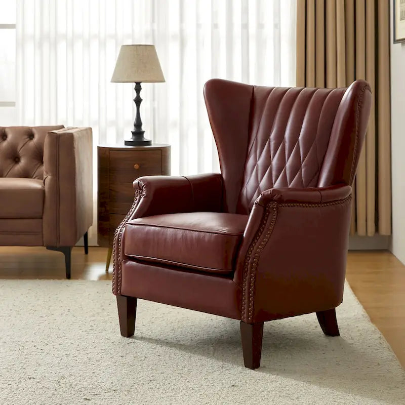 Traditionele fauteuil van echt leer met poten van massief hout