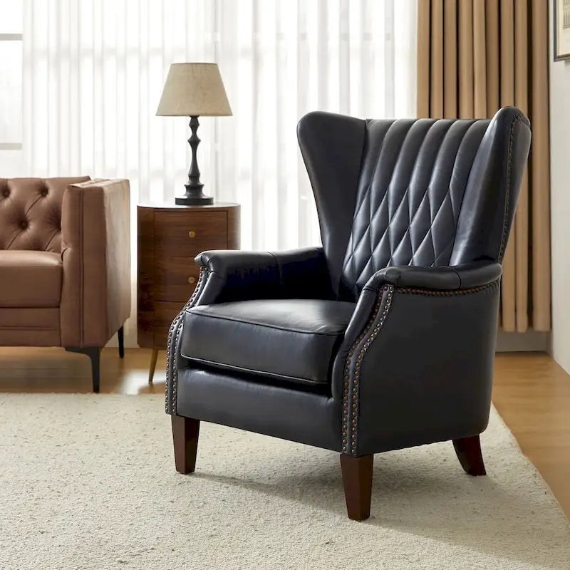 Traditionele fauteuil van echt leer met poten van massief hout